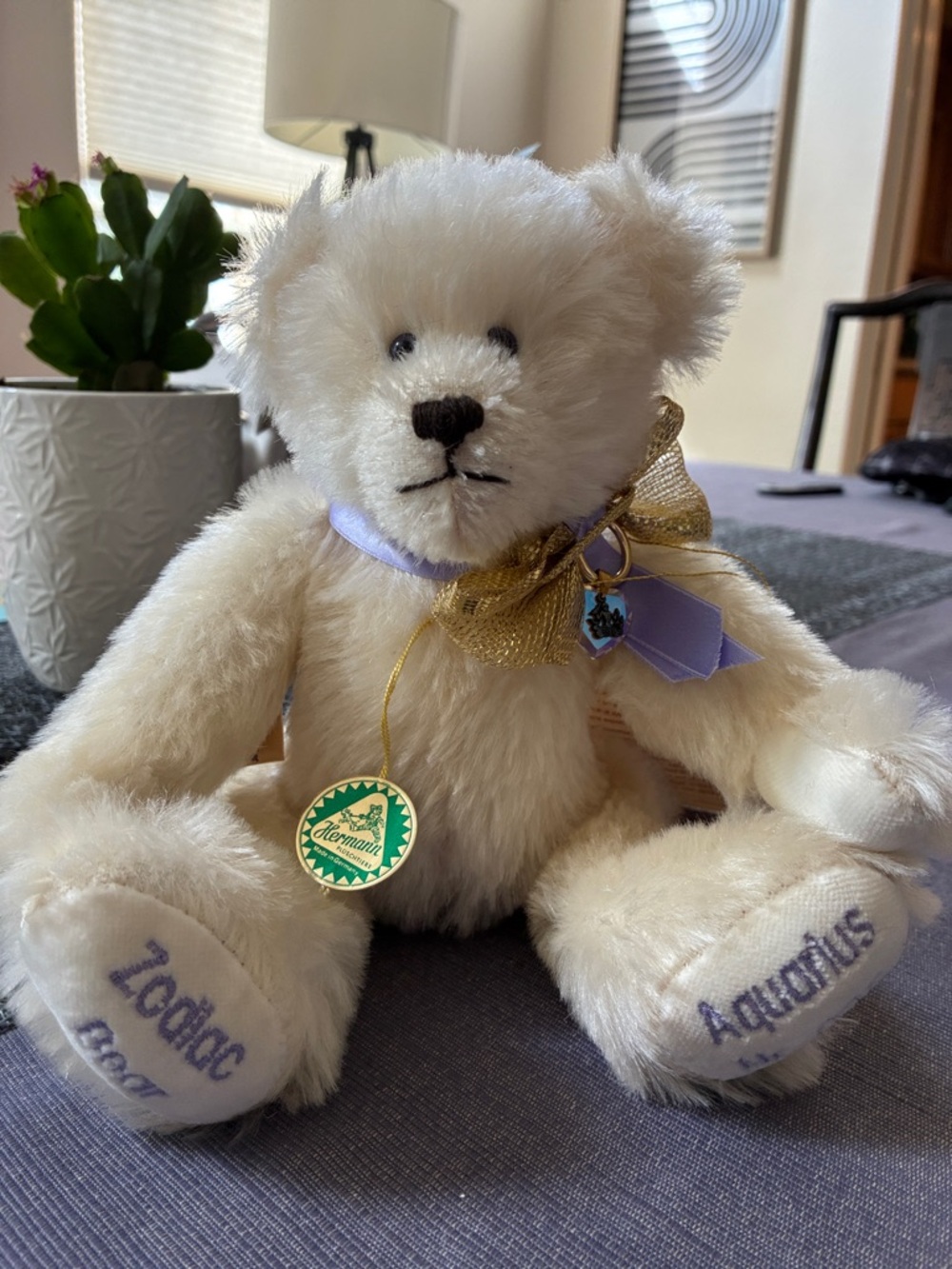 Hermann Lange Cream Plush Bear with Gold Bow and Lavender Ribbon Accents